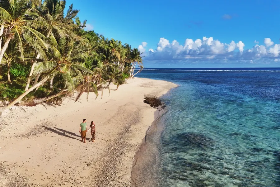 Olosega Beach Sunset Couple CREDIT AmericanSamoaPocketGuide.com