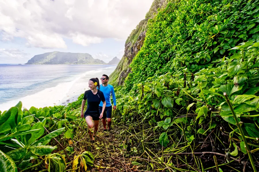 Olosega Oge Beach Hike Couple Walk Trail 1 CREDIT AmericanSamoaPocketGuide.com
